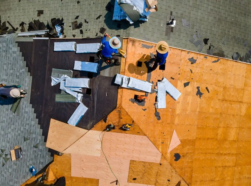 Construction roofer installing roof
