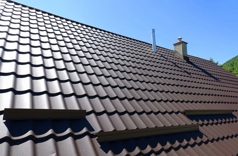 Brown corrugated metal roof installed on a modern house exterior.