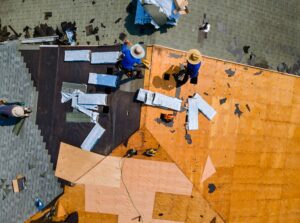 Construction roofer installing roof